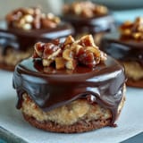 Festive graduation cap cookies decorated with black royal icing and a yellow candy tassel, perfect for celebrating academic milestones.  