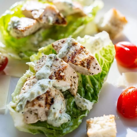A creamy Greek yogurt Caesar dressing coats fresh romaine and juicy grilled chicken in this vibrant Yogurt Caesar Grilled Chicken Salad.  