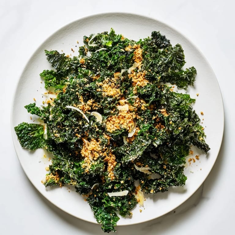 Creamy garlic Parmesan dressing clings to tender, massaged kale leaves, topped with crispy panko breadcrumbs for a satisfying textural contrast.